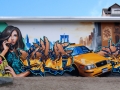 The image shows a collage of New Yorker cityscapes, a yellow taxi cab, a girl giving a phone call and classical graffiti styles from SiveOne and Doc Nova. Painted during September 2009 in Wetzlar.