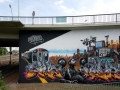 Painted during International Meeting of Styles in Wiesbaden in2009. The wall is around 6,5 meters high and 13 meter long. The image reflects warriors trying to survive in urban landscape while history is repeating itself.